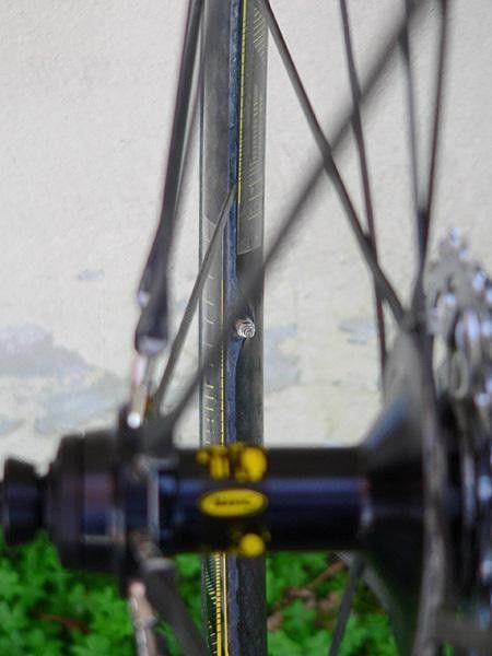 Rear rim incorporates an asymmetric spoke bed for more even spoke tension.