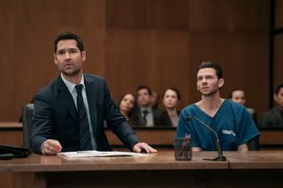 Manuel Garcia-Rulfo as Mickey Haller (left, in a suit) and Devon Graye as Julian La Cosse (right, in a prison uniform), sitting in a courtroom, in episode 303 of The Lincoln Lawyer.