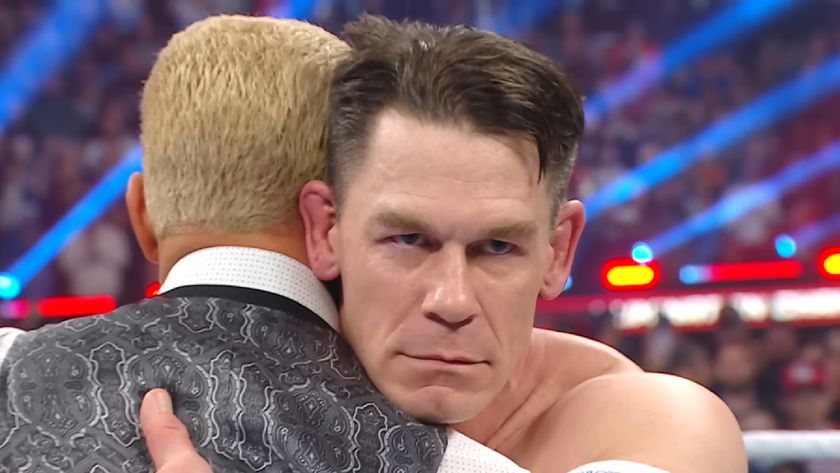 John Cena stares evilly while embracing Cody Rhodes