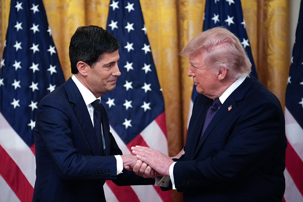 US President Donald Trump, right, and Kevin Warsh, chairman of the US Federal Reserve, shake hands during a swearing-in ceremony in the East Room of the White House in Washington, DC