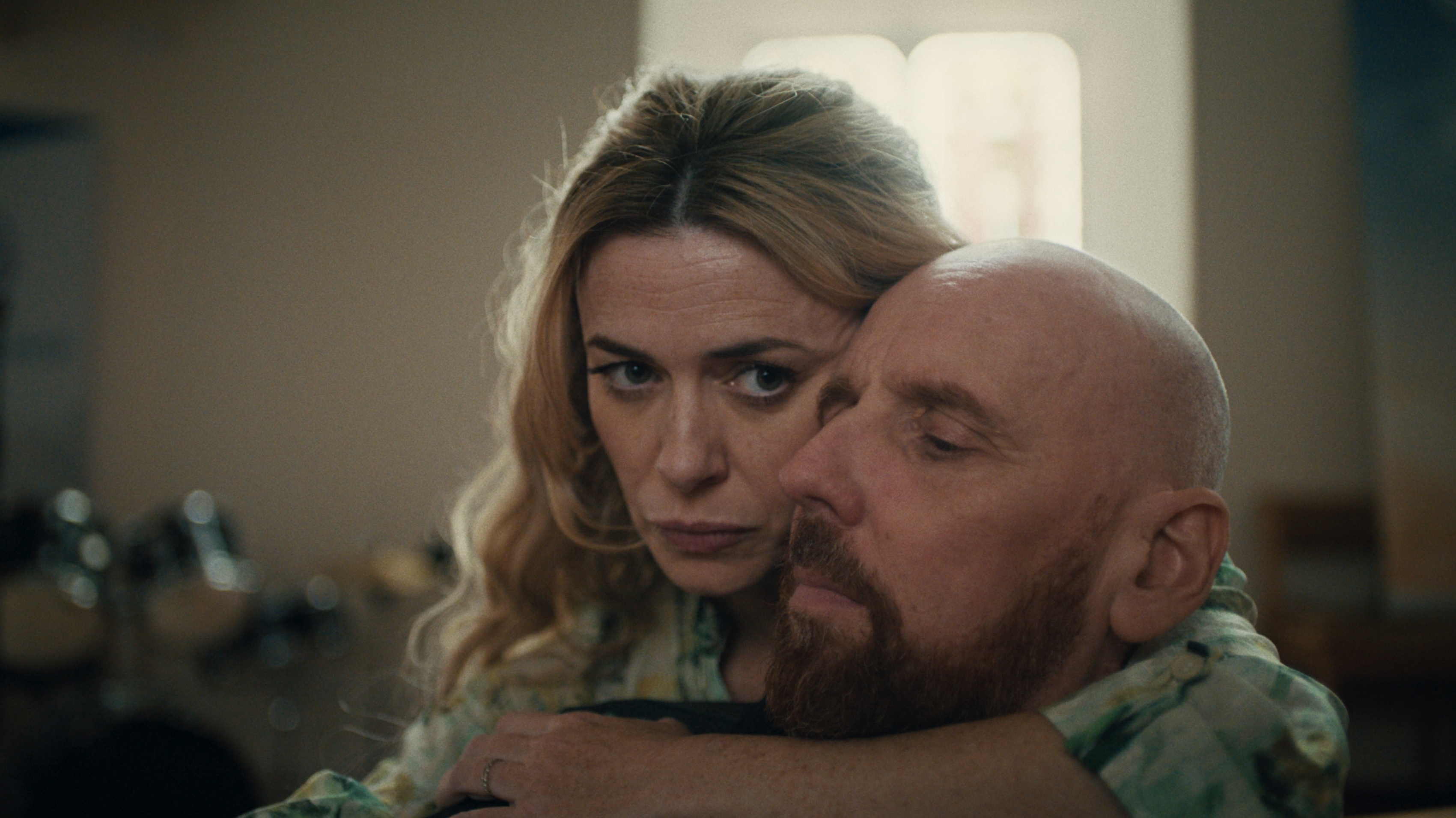 Rebecca (Eve Myles) hugs her husband Tommy (Ewen Bremner)