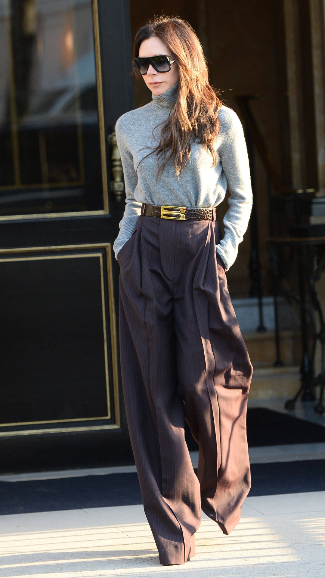 Victoria Beckham wearing wide leg trousers and turtleneck knit in Paris, France on 2 March, 2023