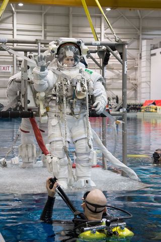 Astronauts Submerging in Waters of Neutral Buoyancy Laboratory