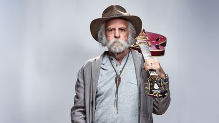 Bob Weir pictured with his red D'Angelico signature guitar