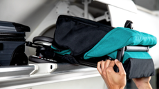 Cybex travel stroller in overhead locker