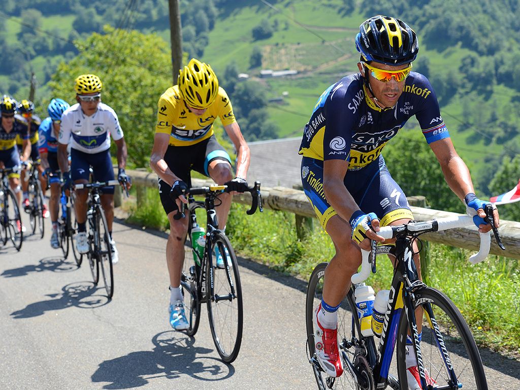 The white jersey of Quintana and the yellow jersey of Froome sit on Contador's wheel