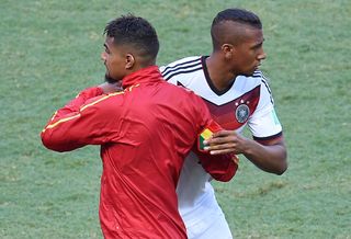 Kevin-Prince Boateng and brother Jerome Boateng embrace ahead of Ghana vs Germany at the 2014 World Cup.
