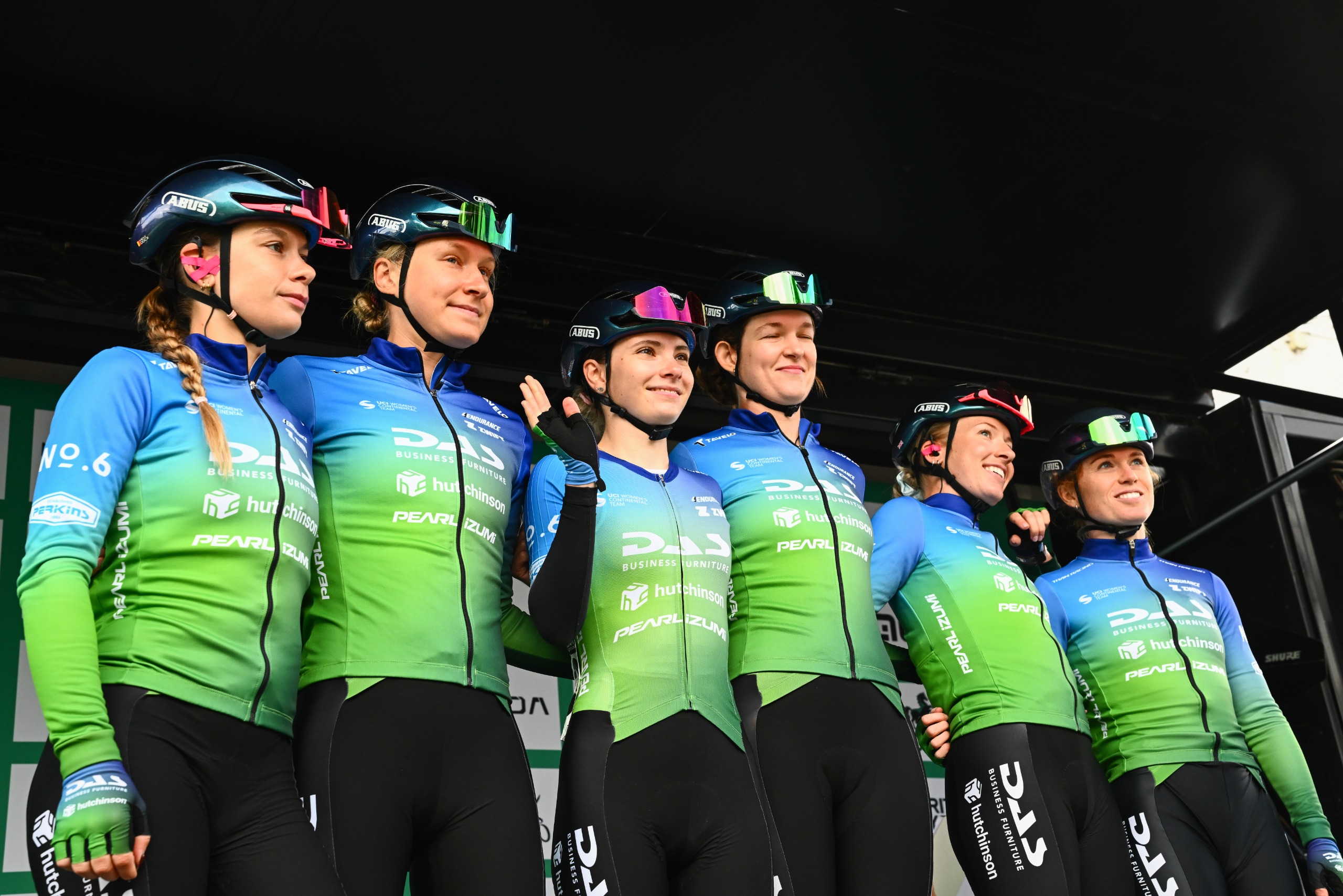 Six Das-Hutchinson riders on a podium