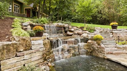 backyard pond ideas with waterfall and stone steps