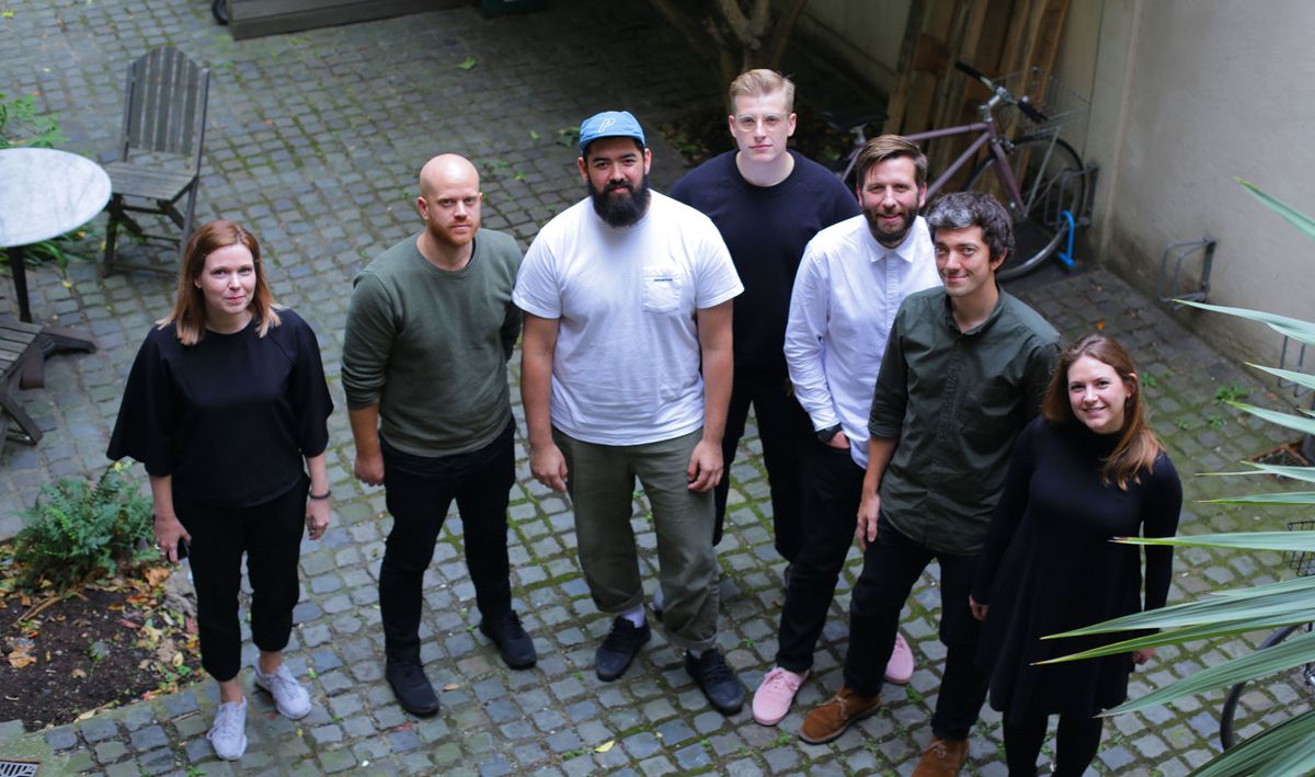 Koto team standing in a courtyard