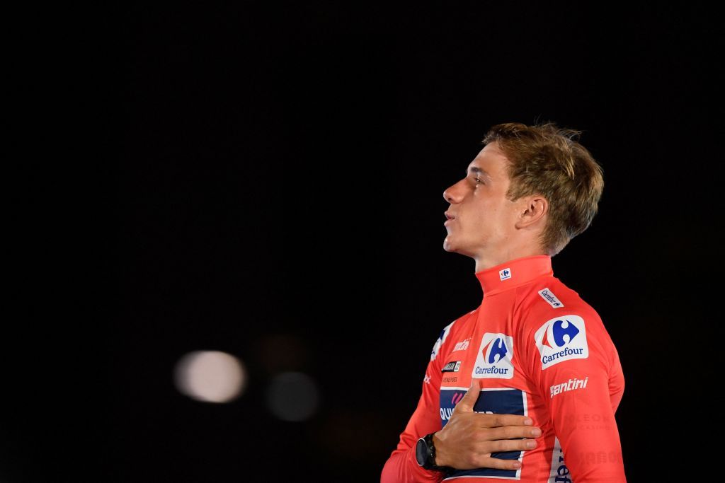 Belgian rider Remco Evenepoel celebrates on the podium wearing the overall leaders red jersey after the 21st and last stage of the 2022 La Vuelta 