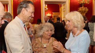 Camilla, Duchess of Cornwall shares a joke with Richard E Grant and Miriam Margolyes as she hosts the 30th Anniversary Garden Party for the National Osteoporosis Society in St James Palace on July 12, 2016 in London, England. Due to inclement weather the event was moved indoors. The Duchess of Cornwall has been connected with the charity for nearly 30 years.