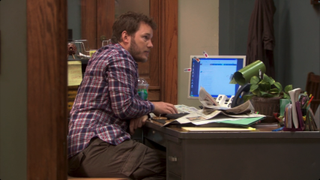 Chris Pratt in front of computer in Parks and Rec Flu Season episode