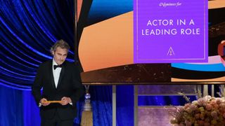 Joaquin Phoenix presents the award for Best Actor at the Oscars 2021