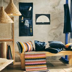 IKEA MAVINN collection in a room, with jute lampshades, a bench, and MAVINN accessories