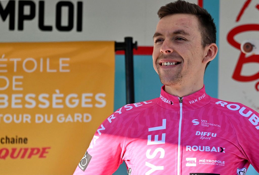 Van Rysel-Roubaix's French rider Samuel Leroux celebrates on the podium after winning the fourth stage of the 54nd Etoile de Besseges-Tour du Gard cycling race between Mejannes-le-Clap and Mejannes-le-Clap on February 3, 2024. (Photo by Sylvain THOMAS / AFP)