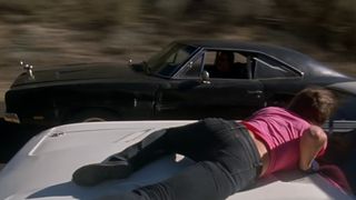 The Death Proof car threatens another vehicle of female riders in Death Proof