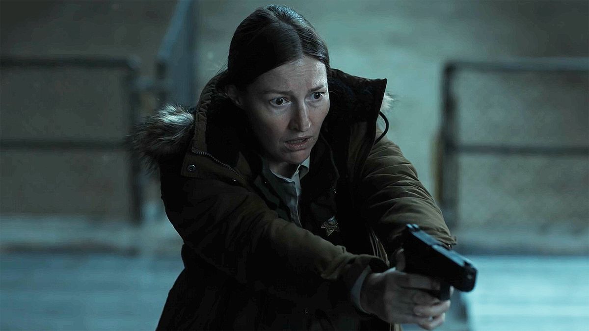 Kerry Kane looking shocked and holding her handgun in the Lanterns season 1 finale