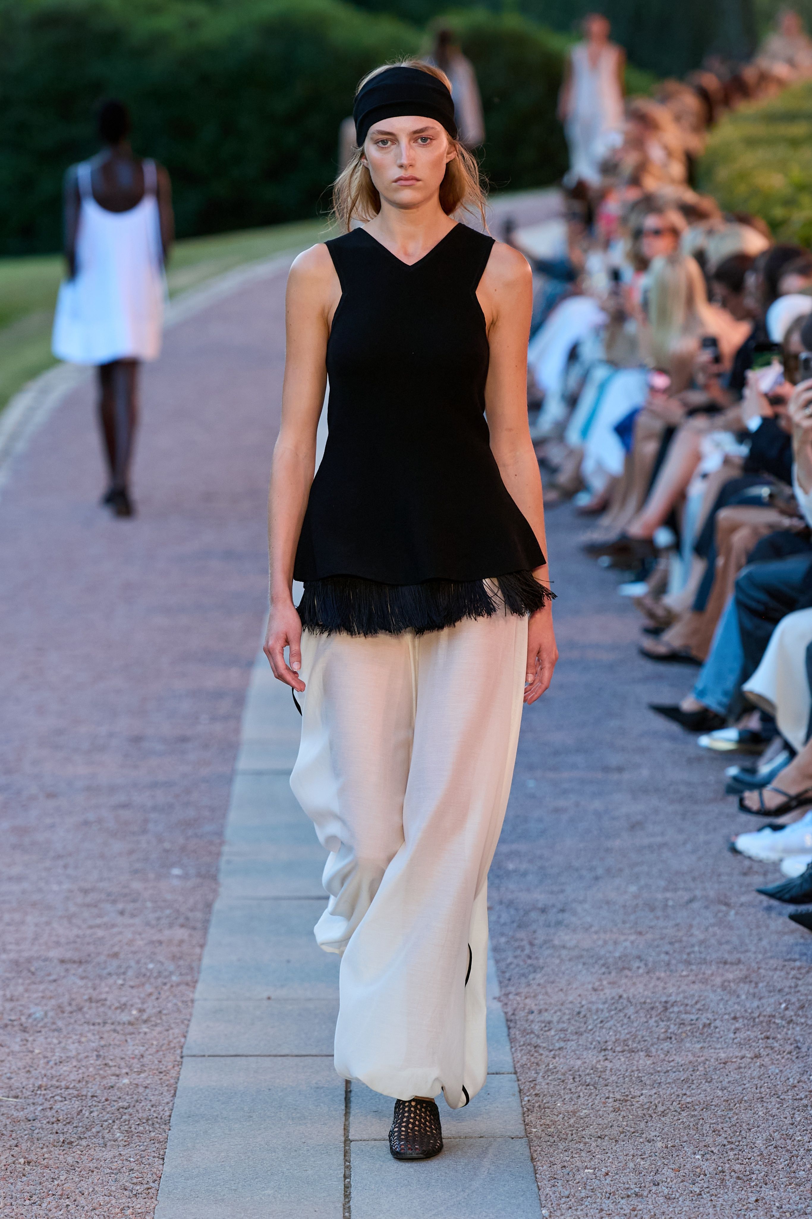 Spring 2027 Copenhagen Fashion Week looks featuring fringe and textured details in neutral tailoring from The Garment, Mr Larkin, MKDT Studio, and By Malene Birger.