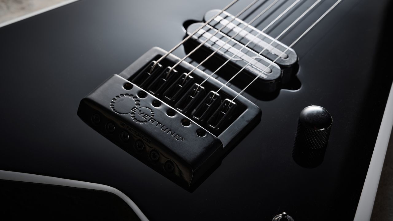 Close up of the front of the Evertune bridge on the Jackson Pro Plus Series Signature Christian Andreu Rhoads RR24 EVTN6 electric guitar