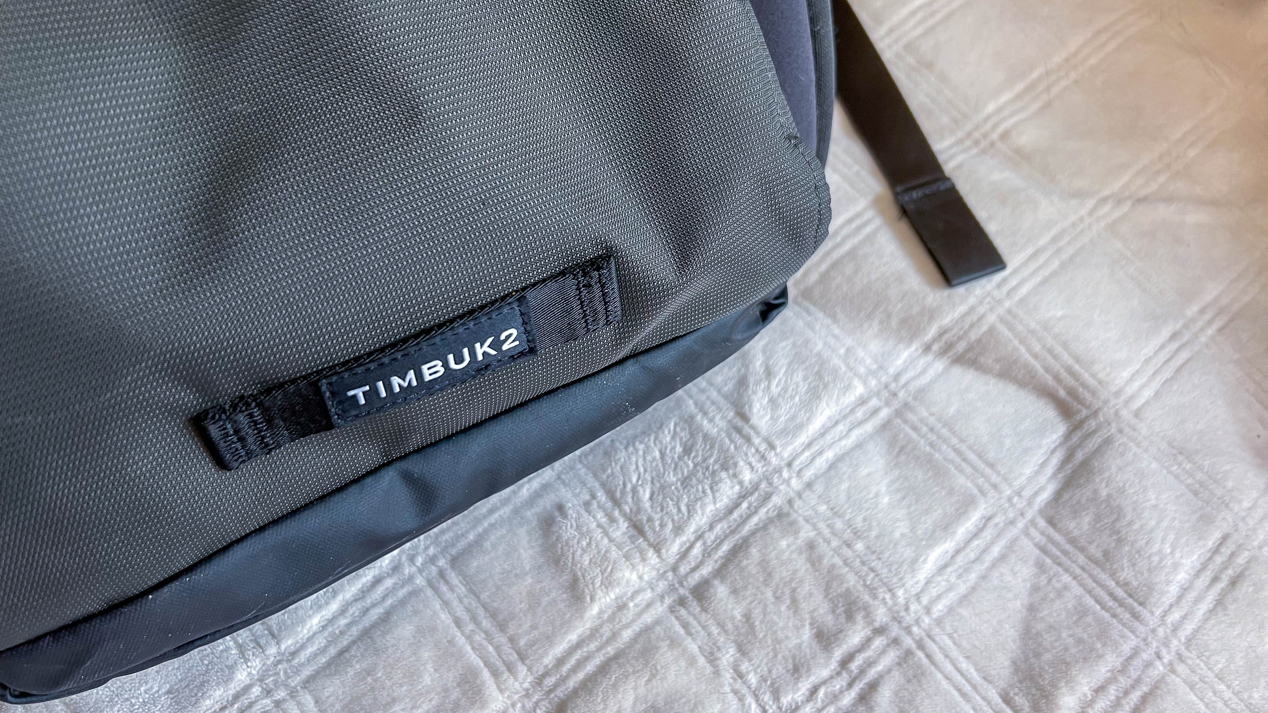 Timbuk2 Division Laptop Backpack Deluxe on the reviewer's couch