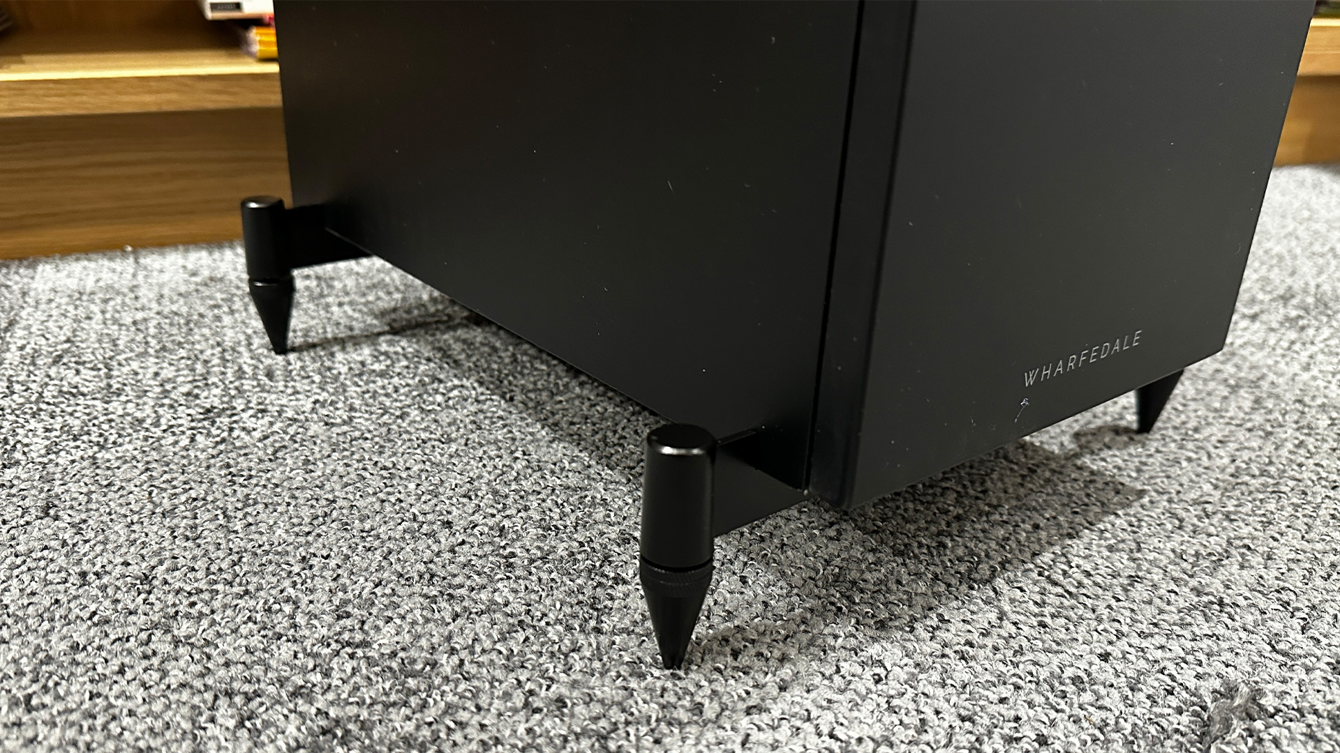 Wharfedale Diamond 12.3i floorstanding speakers on grey carpet detail of feet