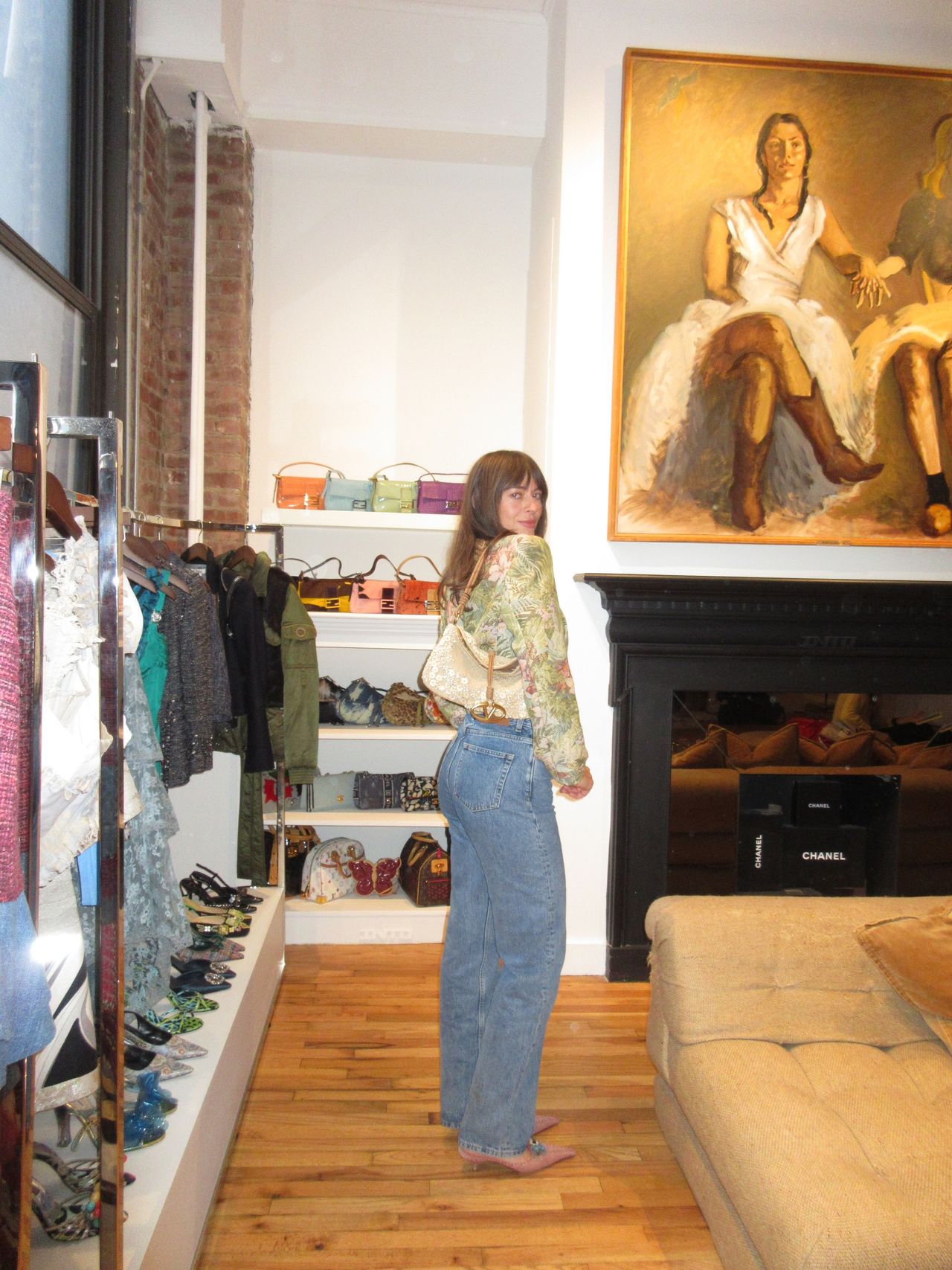 Kathryn Zahorak wearing floral jacket, white bag, jeans