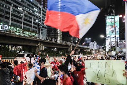Supporters of Ferdinand 'Bongbong' Marcos Jr. celebrate in Manila