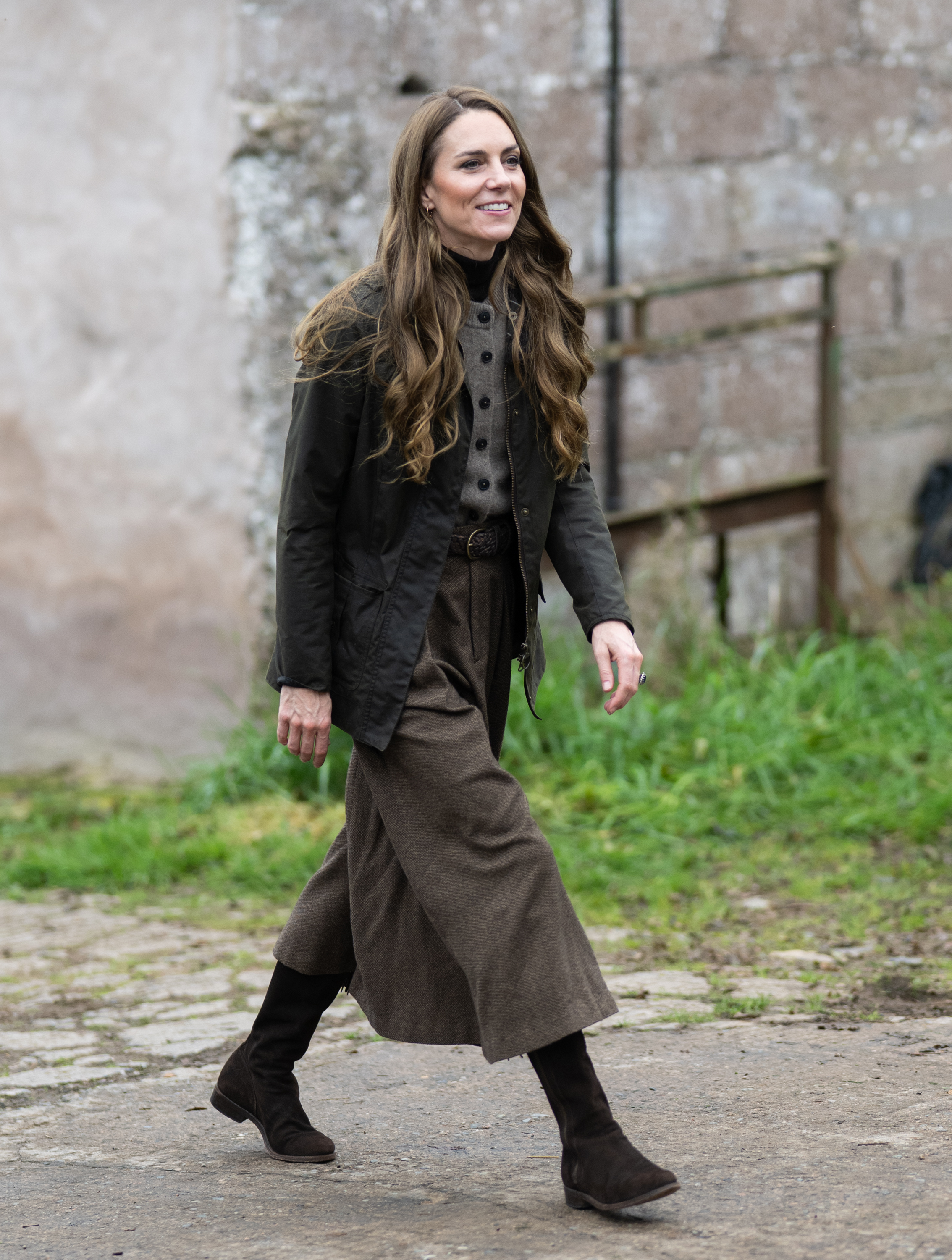 Princess Kate walking in a long skirt, boots and jacket