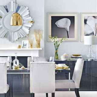 Monochrome dining room with metallic accents
