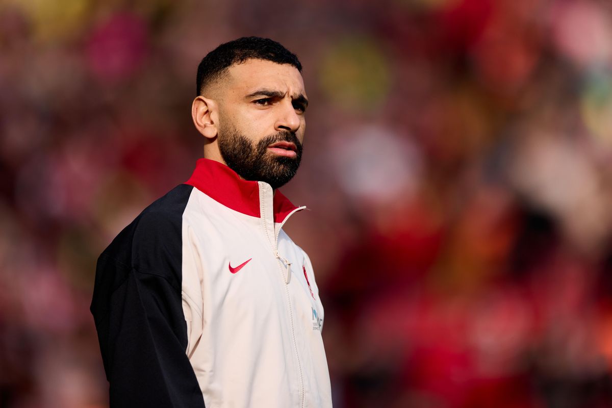 Mohamed Salah of Liverpool, wearing a white, black and red tracksuit top, looks on ahead of the Premier League match against Southampton at Anfield on 8 March, 2025