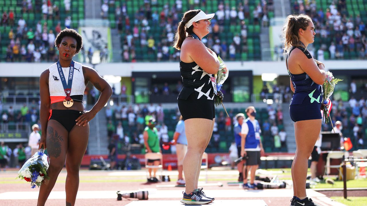 eugene, oregon june 26 gwendolyn berry l, third place, turns away from us flag during the us national anthem as deanna price c, first place, and brooke andersen, second place, also stand on the podium after the womens hammer throw final on day nine of the 2020 us olympic track field team trials at hayward field on june 26, 2021 in eugene, oregon in 2019, the usopc reprimanded berry after her demonstration on the podium at the lima pan american games photo by patrick smithgetty images