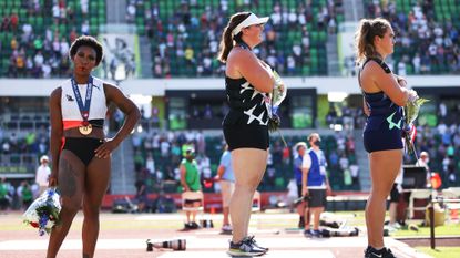 eugene, oregon june 26 gwendolyn berry l, third place, turns away from us flag during the us national anthem as deanna price c, first place, and brooke andersen, second place, also stand on the podium after the womens hammer throw final on day nine of the 2020 us olympic track field team trials at hayward field on june 26, 2021 in eugene, oregon in 2019, the usopc reprimanded berry after her demonstration on the podium at the lima pan american games photo by patrick smithgetty images