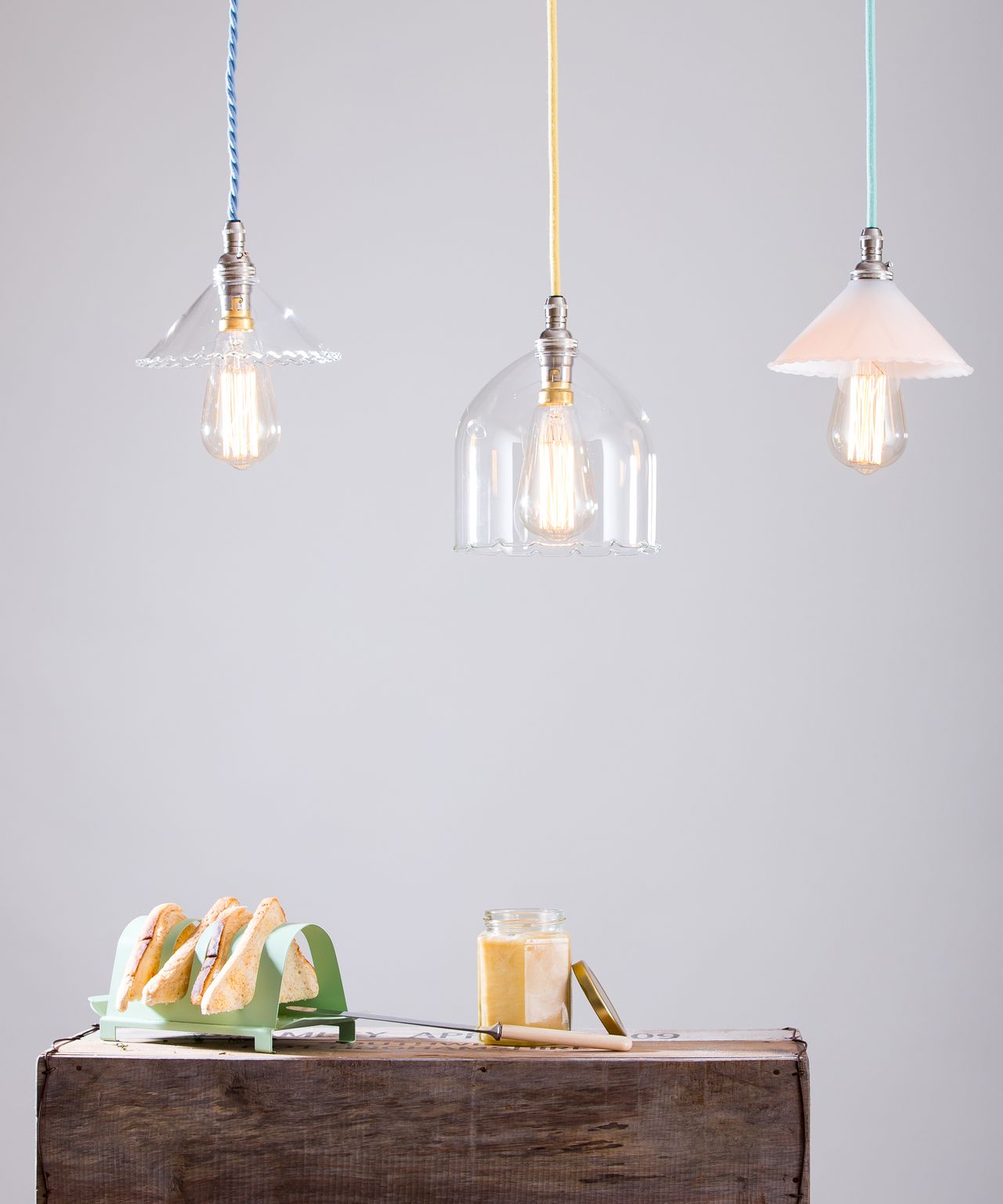 trio of hanging sculptural glass pendants