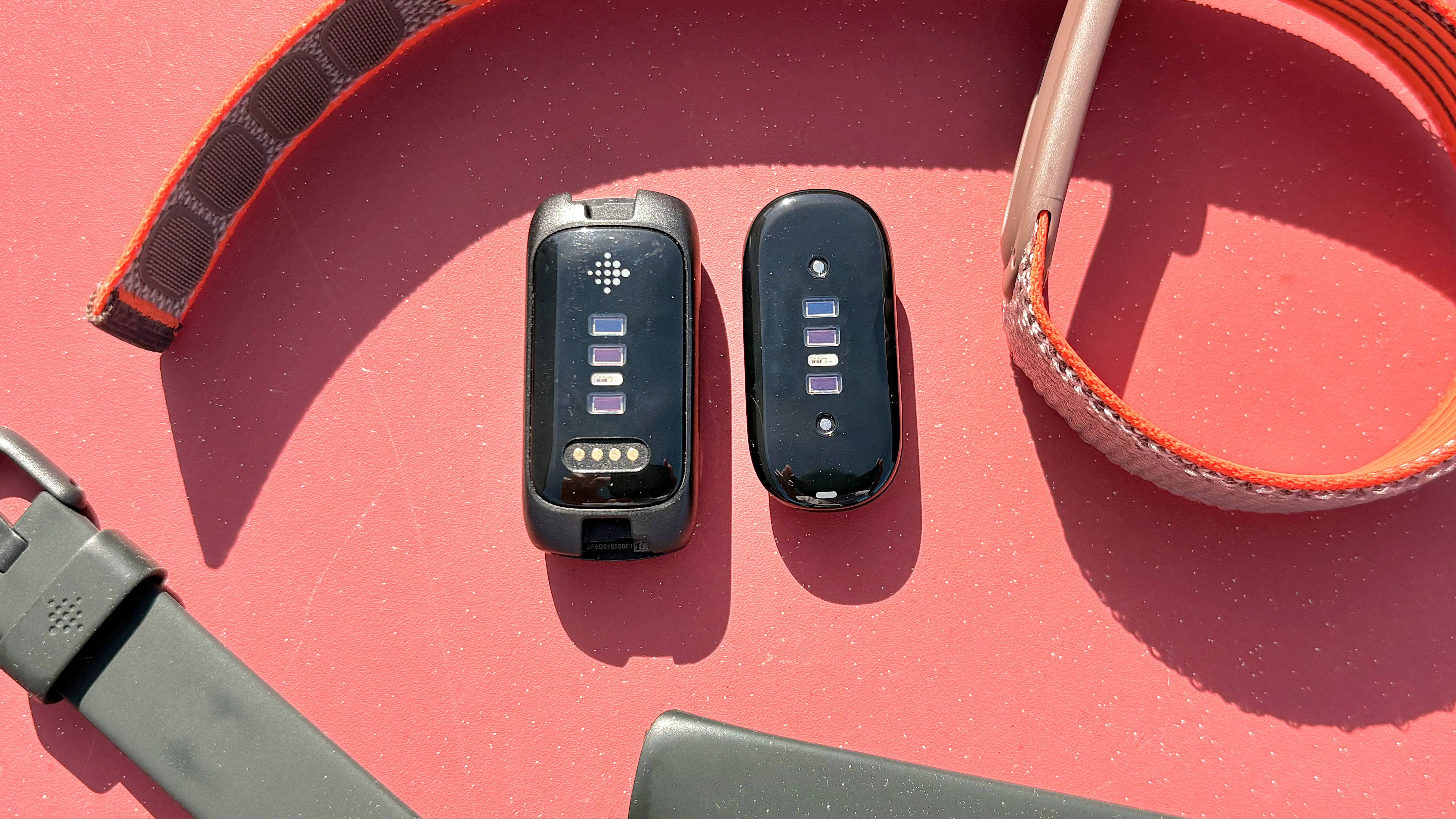 Close-up of the Fitbit Air next to the Fitbit Inspire 3