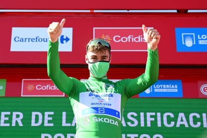 Fabio Jakobsen on the podium in his green jersey after winning the fourth stage of the 2021 Vuelta