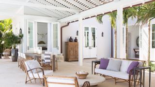 outdoor living space in Florida, combining antiques with new furnishings.