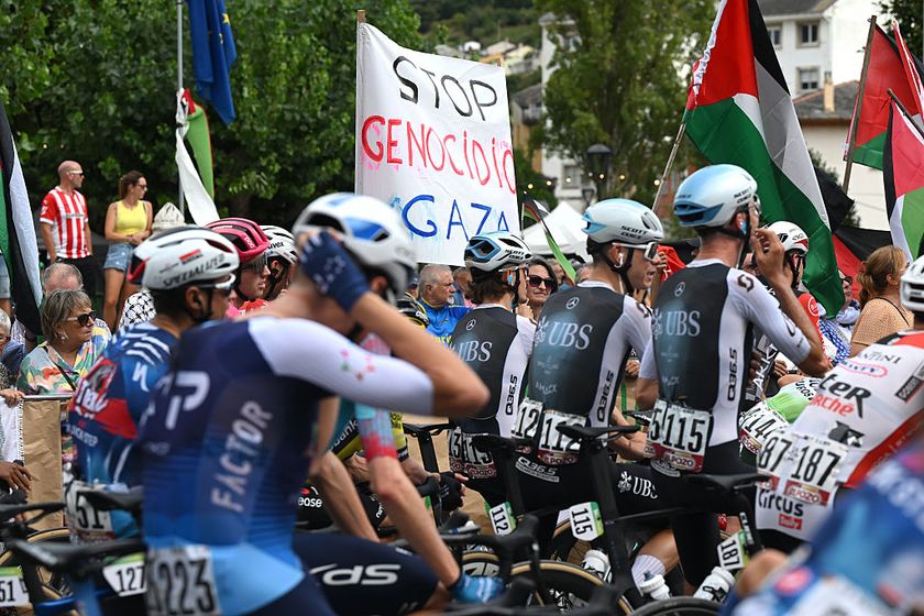 Pro-Palestinian protesters and the peloton prior to the La Vuelta - 80th Tour of Spain 2025, Stage 15 a 167.8km stage from A Veiga-Vegadeo to Monforte de Lemo