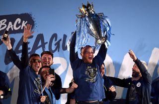 Kompany holds aloft the Premier League trophy