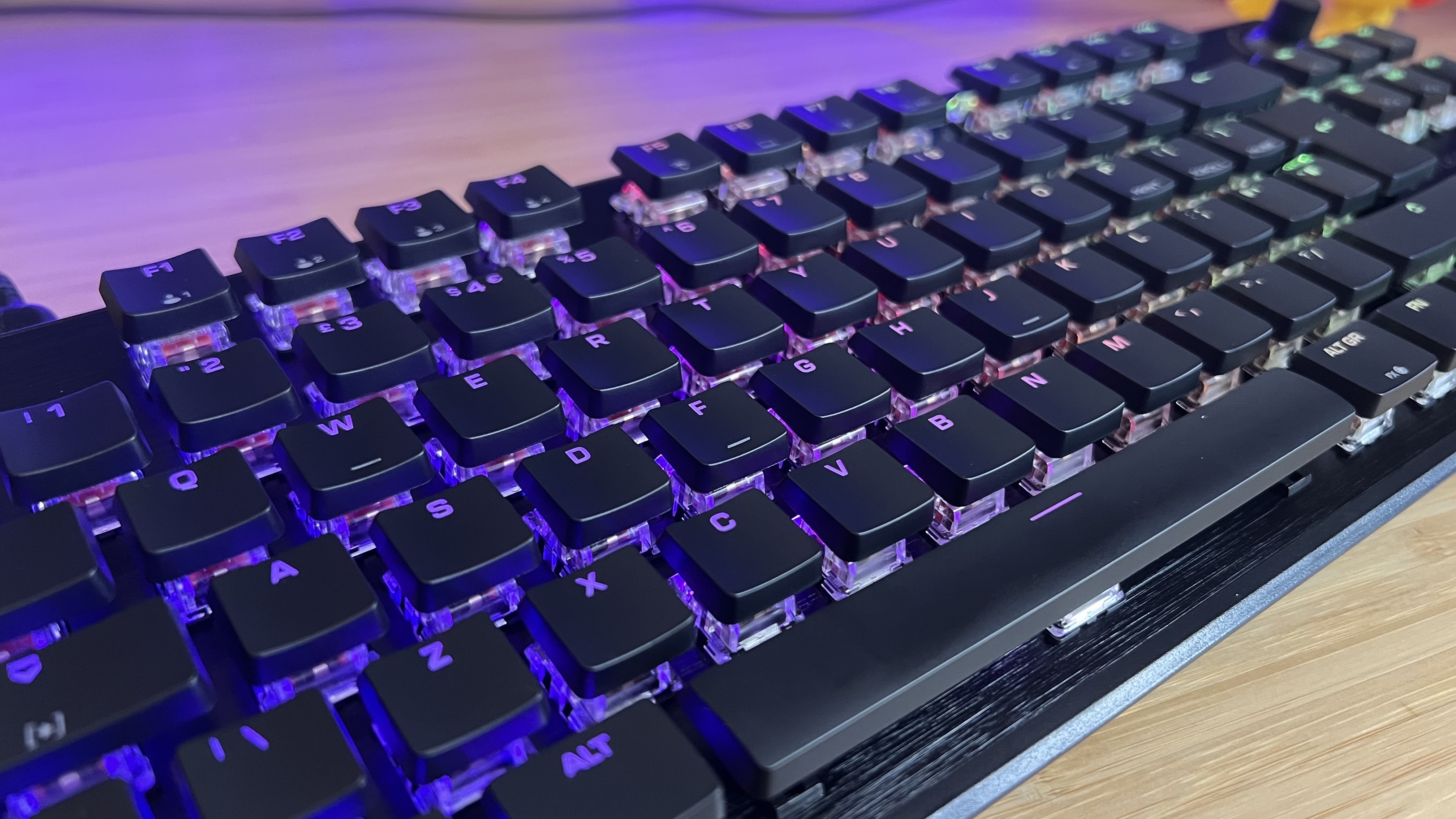 Close up on Turtle Beach Vulcan II TKL keycaps with RGB lighting on