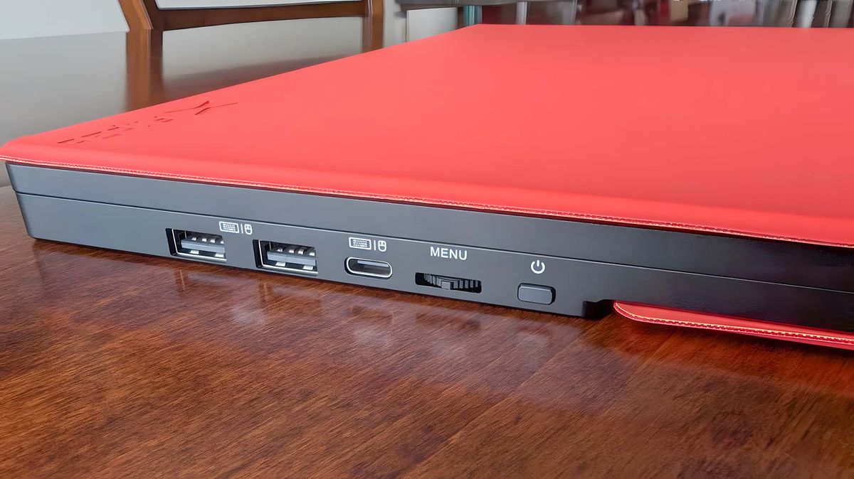 Closeup of the JSAUX FlipGo Pro 16's two USB-A ports, USB-C port, menu dial, and power button.