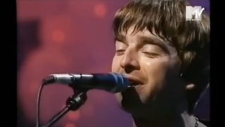 Noel Gallagher performing with Oasis for MTV Unplugged in 1996 
