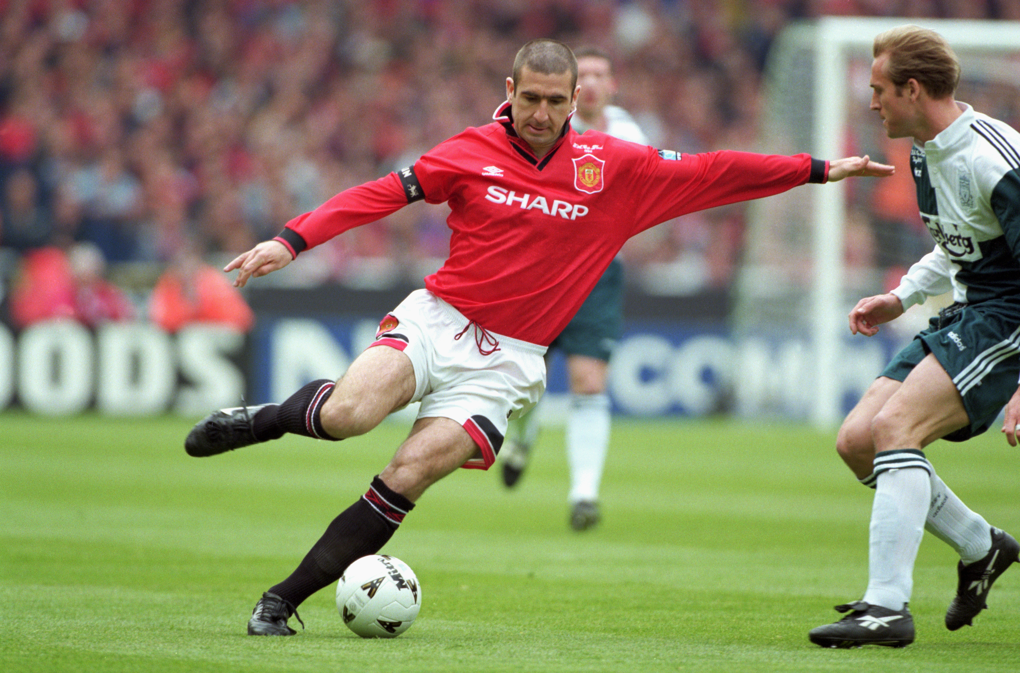 Eric Cantona in action for Manchester United in the 1996 FA Cup final against Liverpool.