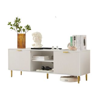 A white console table with decor on it