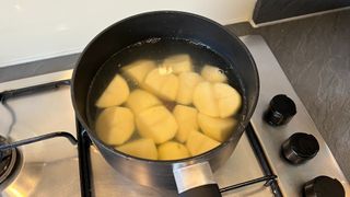 Potatoes for air fryer croquettes being boiled