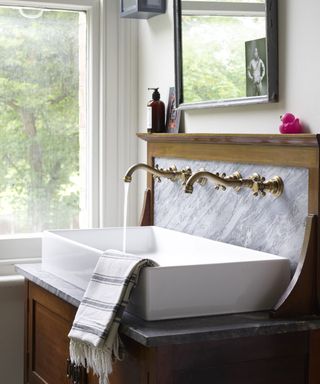 marble bathroom with white basin