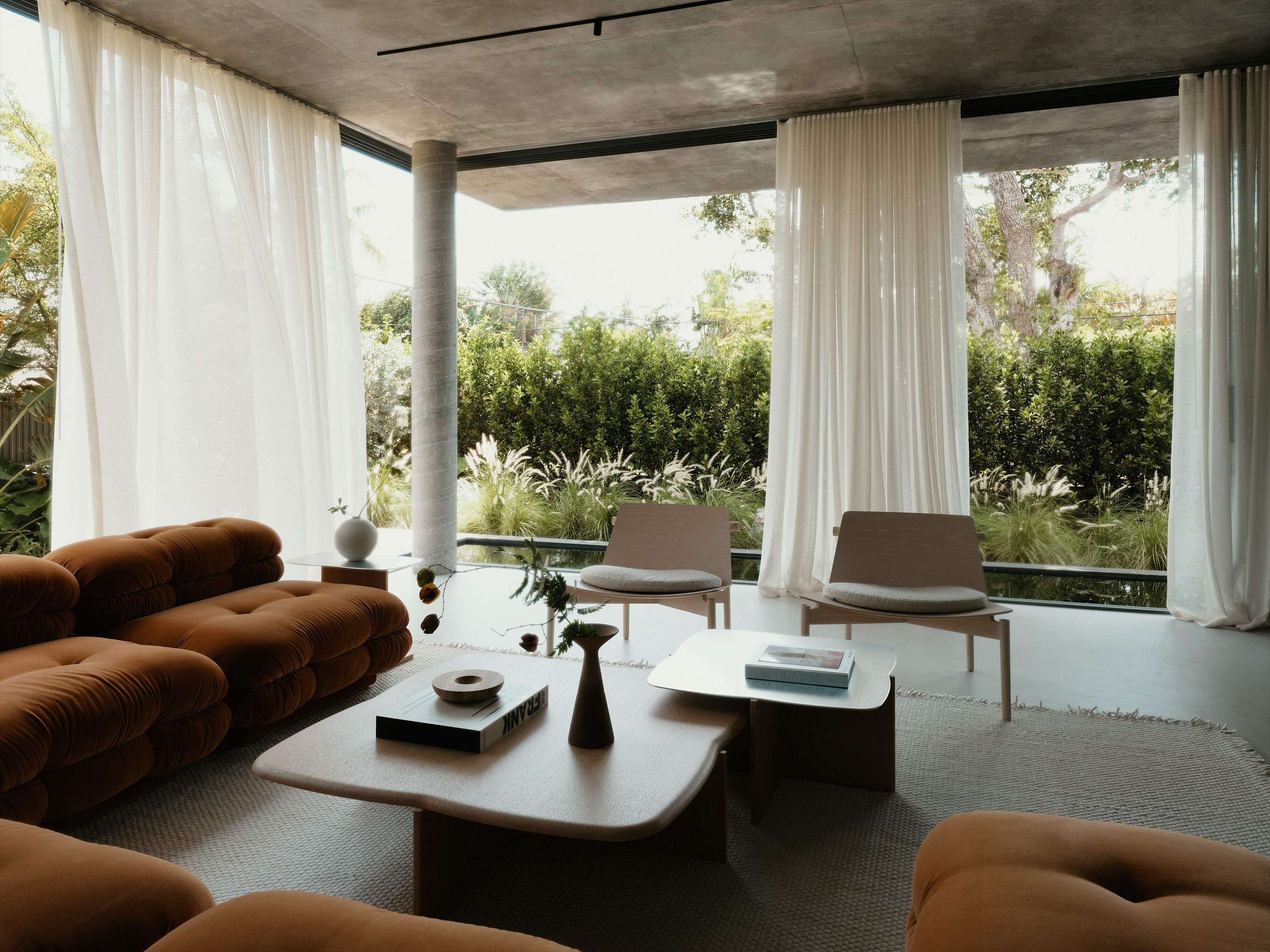 Miami house by studiokp2, a minimalist concrete building with clean surfaces and monumental volumes
