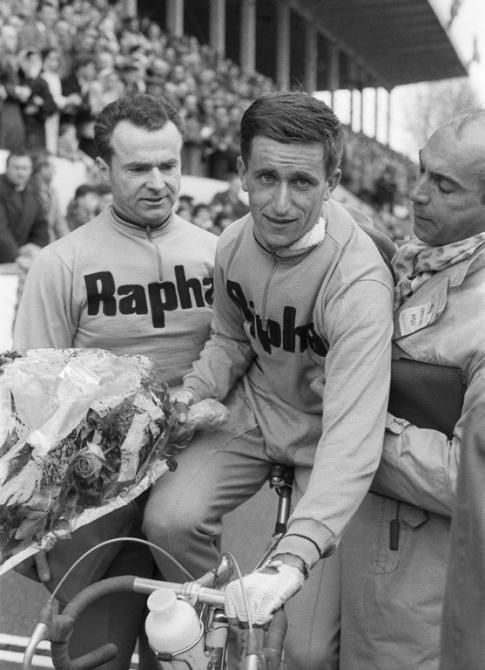 British cyclist Tom Simpson (C) is congratulated at the end of the Paris-Roubaix cycling course, 11 April 1960 in Roubaix, after arriving in ninth place