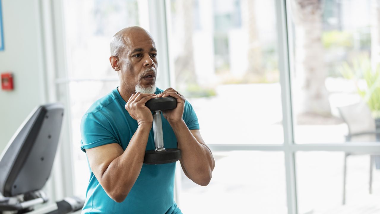 Man exercising with dumbbell