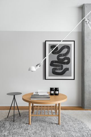 A long lighting piece over a dining table